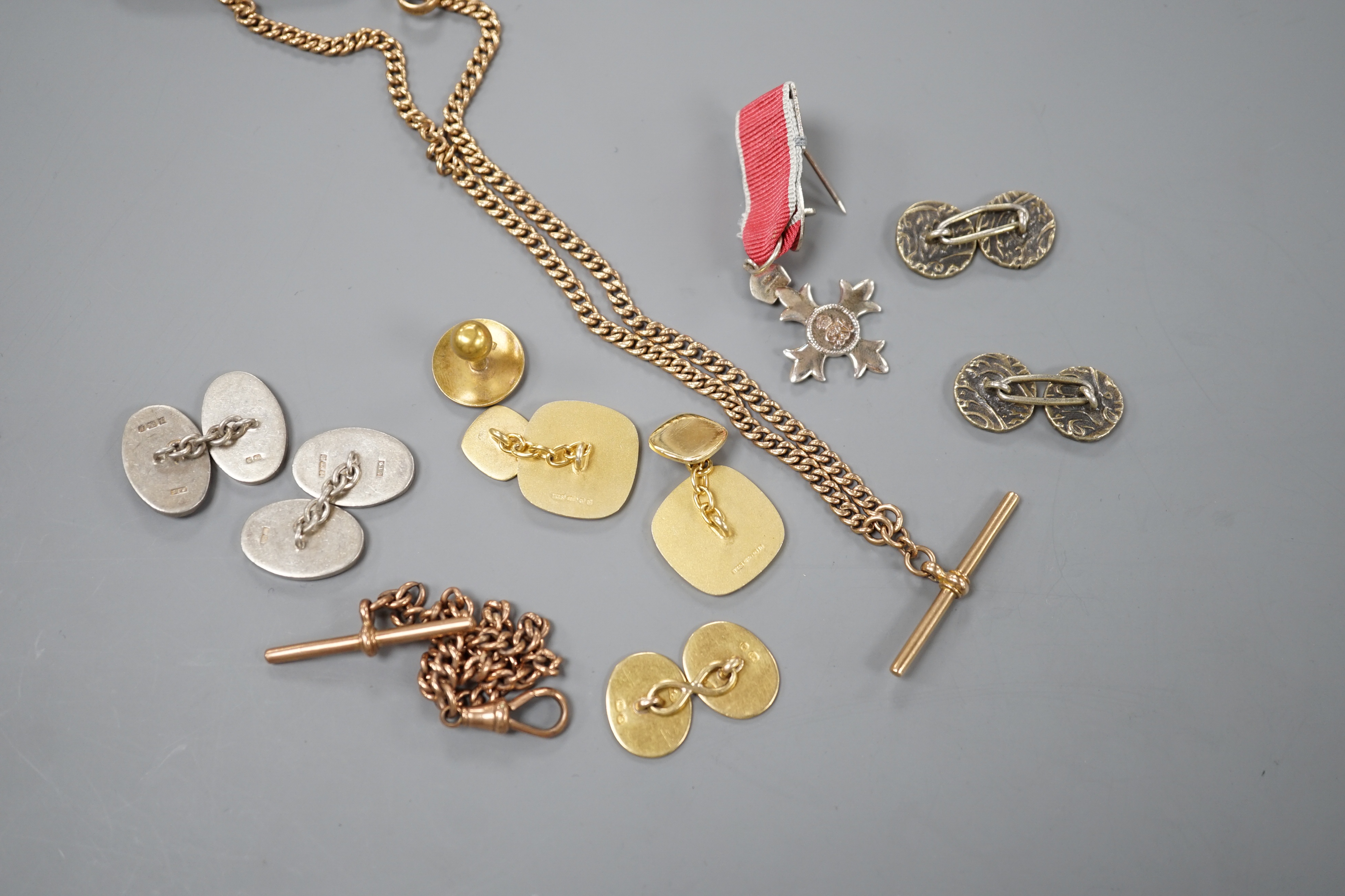 A modern pair of silver gilt and enamel cufflinks, an Edwardian 9ct gold albert, 41cm, 17.9 grams, a smaller 9ct gold albert, 19.5cm, 10.6 grams, an 18ct gold cufflink and dress stud stamped 18, gross 8.4 grams, two othe
